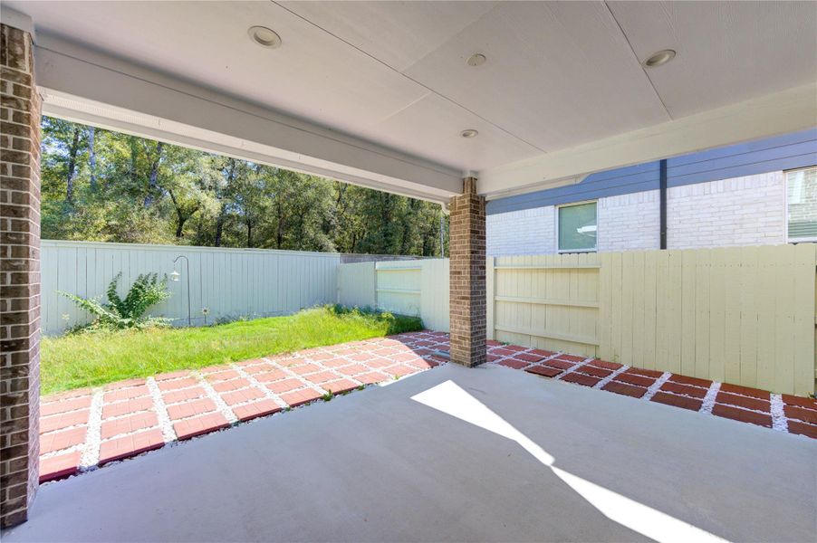 Exterior details and patio area of a home in Harper’s Preserve, Conroe (Image 2).