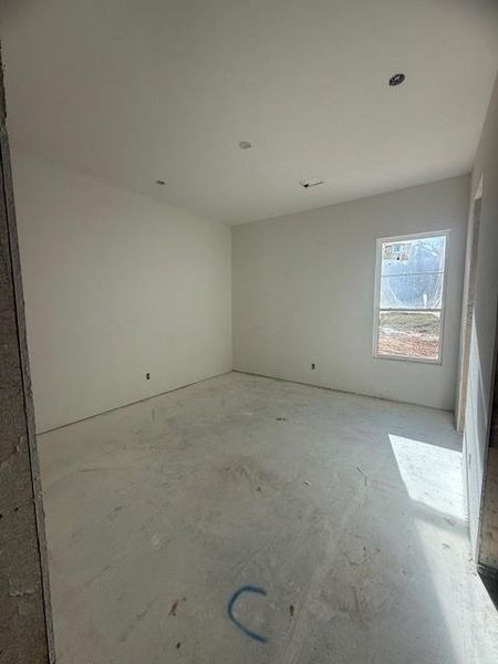 Bedroom with walk-in closet and an en-suite bath. This room will be carpeted.