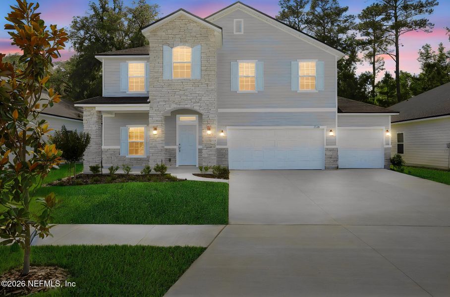 Front exterior of a new home in Jennings Farm, Middleburg, FL, highlighting curb appeal (Image 24). Front exterior of a new home in Jennings Farm, Middleburg, FL, highlighting curb appeal (Image 24).