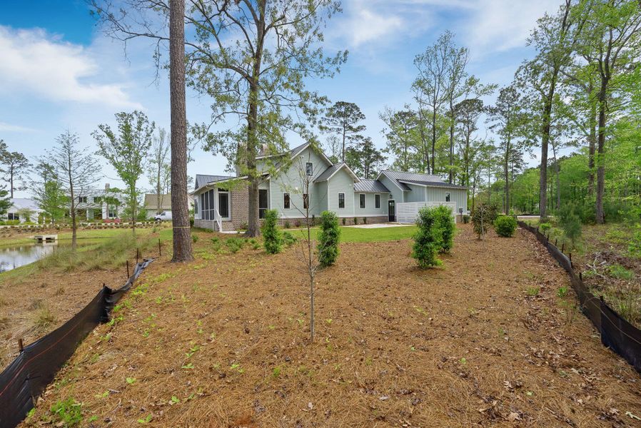 Front exterior of a new home in , Ravenel, SC, highlighting curb appeal (Image 32).