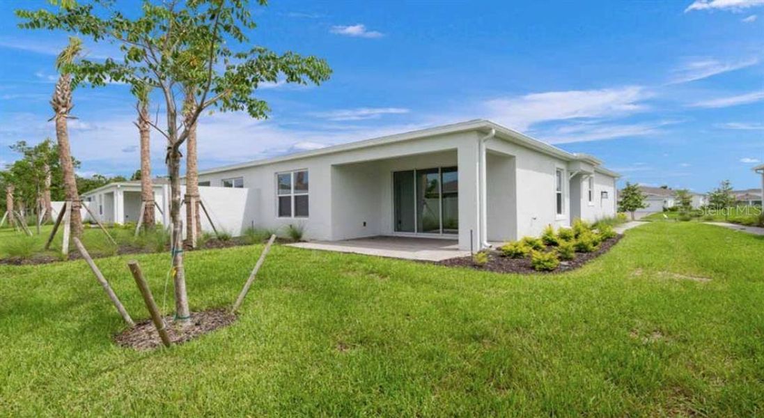 Exterior details and patio area of a home in The Cove at West Port, Port Charlotte (Image 3).