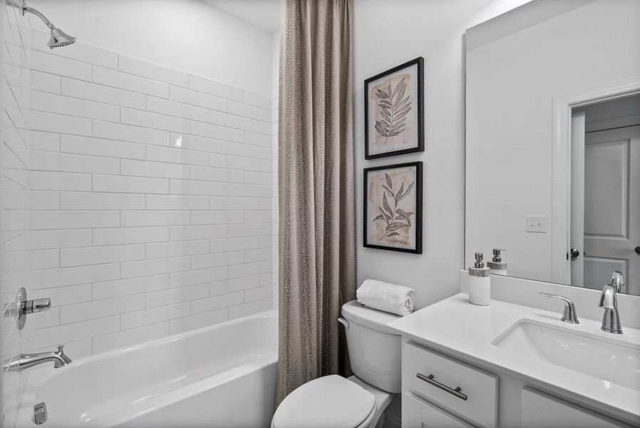 Representative furnished interior of a home built from the The Magnolia by The Providence Group in Market Square at Sawnee Village, Cumming (Image 7).