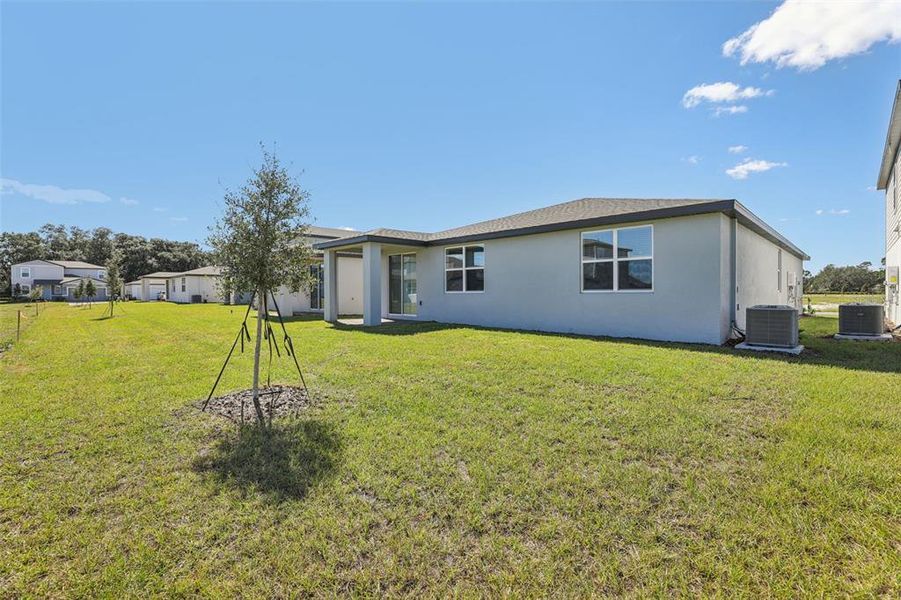 Exterior details and patio area of a home in The Reserve at Twin Lakes, St. Cloud (Image 3).