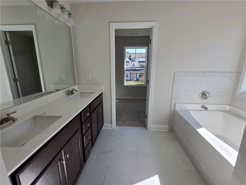 Furnished interior view inside a new home in Enclave at Logan Point, Loganville (Image 12).