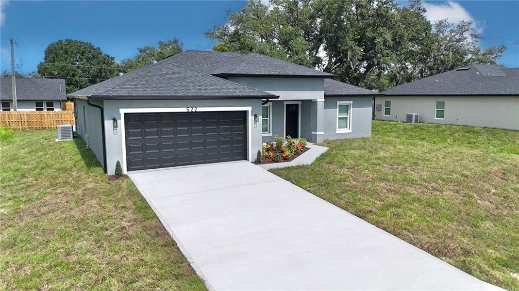 Front exterior of a new home in , Port Charlotte, FL, highlighting curb appeal (Image 27).