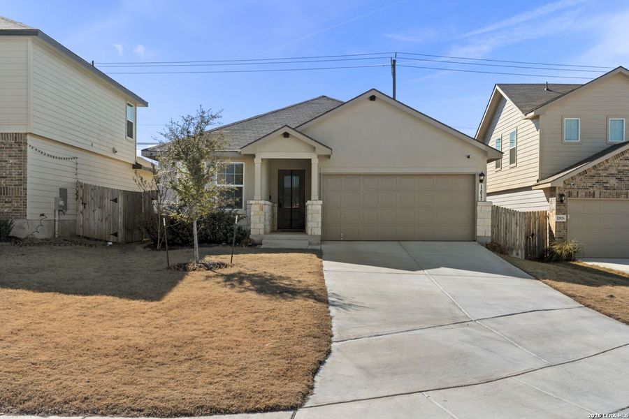 Front exterior of a new home in The Canyons at Amhurst, San Antonio, TX, highlighting curb appeal (Image 2).