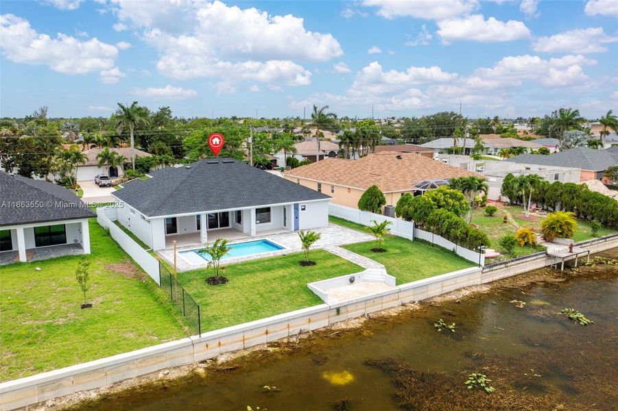 Front exterior of a new home in , Cape Coral, FL, highlighting curb appeal (Image 26). Front exterior of a new home in , Cape Coral, FL, highlighting curb appeal (Image 26).