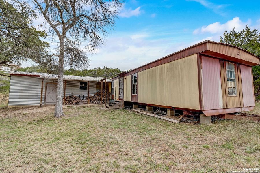 Front exterior of a new home in , Bandera, TX, highlighting curb appeal (Image 21).