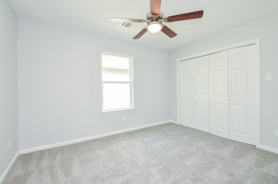 secondary bedroom with good closet space—ideal for guests or nursery.