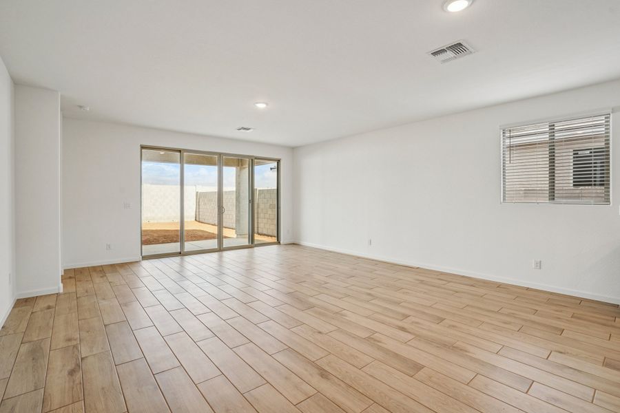 Great room with upgraded 4 panel slider. Colors and finishes may vary by community.
