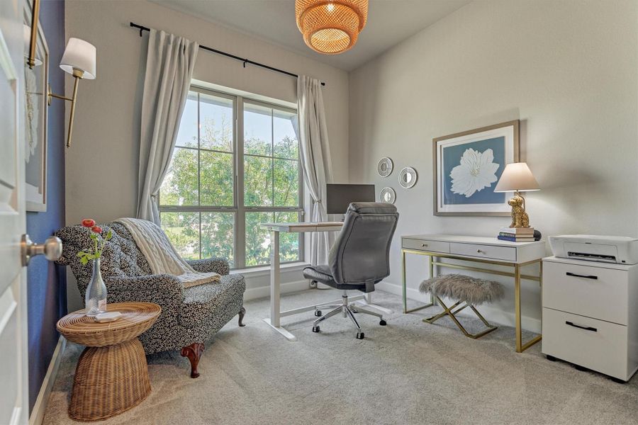 Bedroom with blue accent wall, rattan chandelier, velvet black out window coverings and Anthropology tie backs.