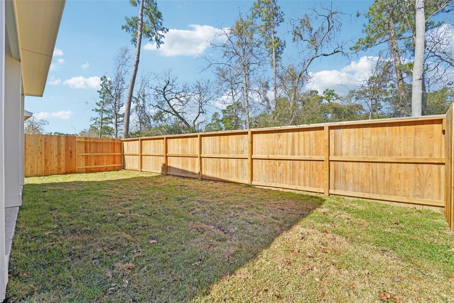 Exterior details and patio area of a home in Pinewood Trails - City Series, Atascocita (Image 22).