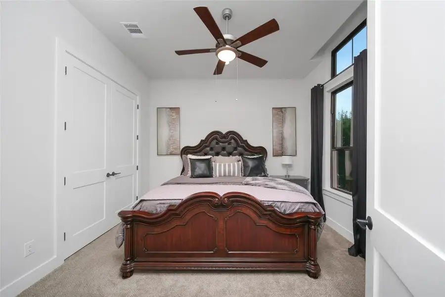 Furnished interior view inside a new home in ARTAVIA, Conroe (Image 27).