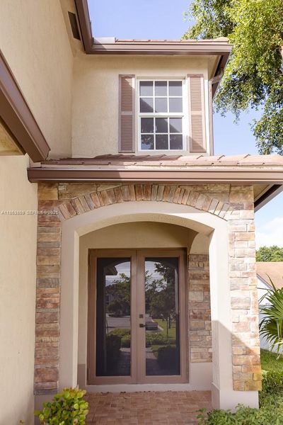 Exterior details and patio area of a home in , Tamarac (Image 33).