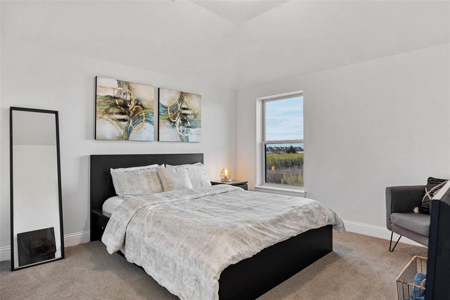 Carpeted bedroom with baseboards