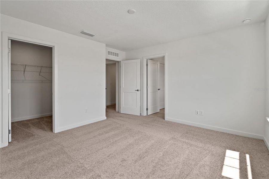 Primary bathroom with walk-in closet.