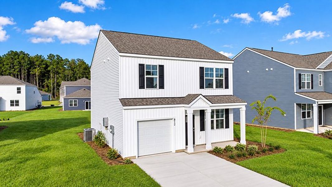 Front exterior of a new home in Pine Hills at Cane Bay, Summerville, SC, highlighting curb appeal (Image 2). Front exterior of a new home in Pine Hills at Cane Bay, Summerville, SC, highlighting curb appeal (Image 2).