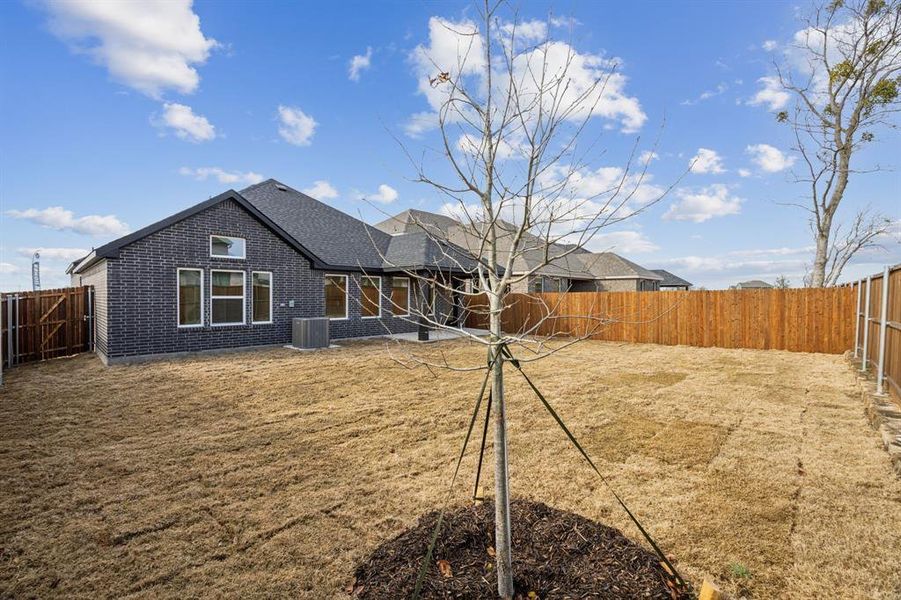 Back of property with a fenced backyard