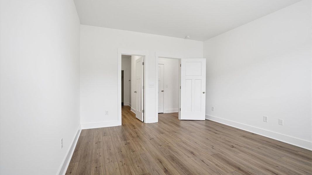 Eye-catching details and elegant finishes in the vibrant primary suite of this select home in Anderson, SC Eye-catching details and elegant finishes in the vibrant primary suite of this select home in Anderson, SC