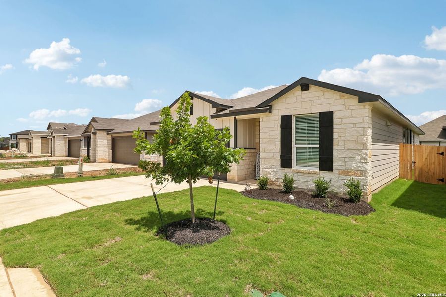 Front exterior of a new home in Estancia Ranch - Premier Series, San Antonio, TX, highlighting curb appeal (Image 23).