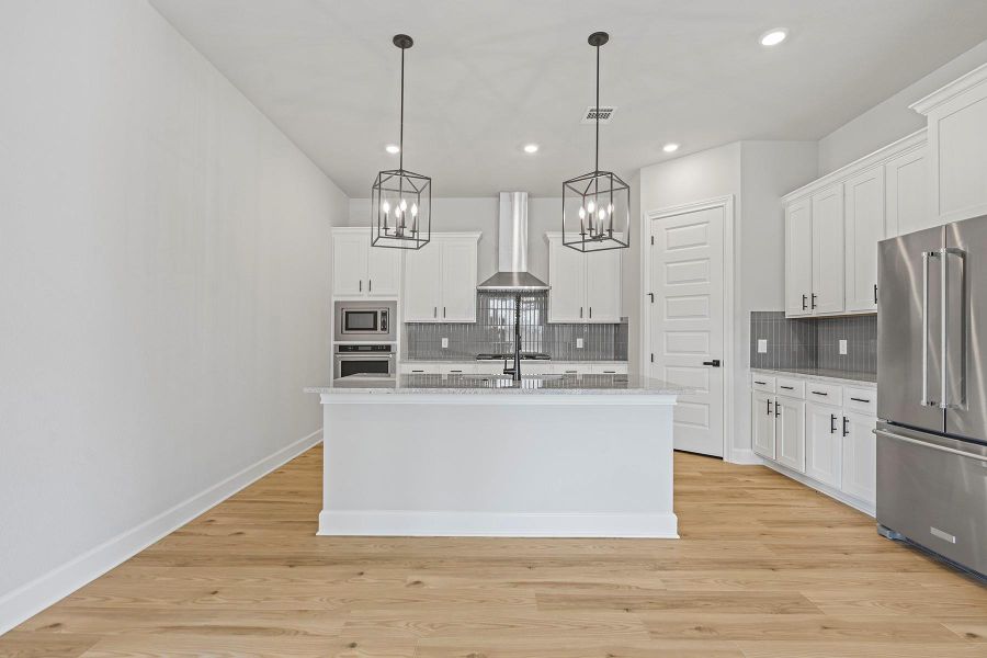 The fully loaded kitchen is like a playground for your inner chef complete with stainless steel kitchen appliances and an oversized island.