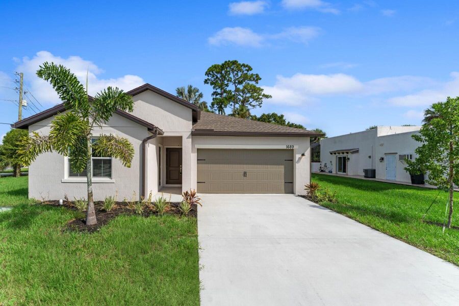 Front exterior of a new home in , Port St. Lucie, FL, highlighting curb appeal (Image 24). Front exterior of a new home in , Port St. Lucie, FL, highlighting curb appeal (Image 24).