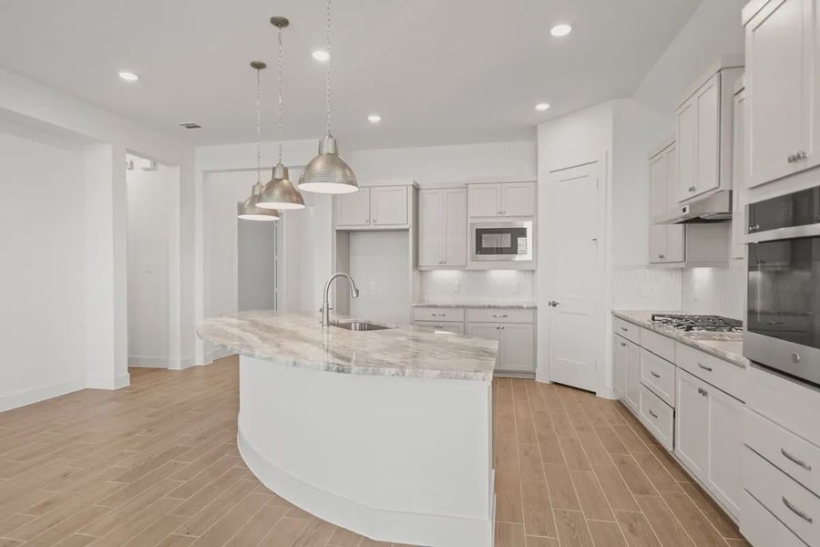 Representative furnished interior of a home built from the Mariah by Chesmar Homes in Lakes of Cane Island, Katy (Image 8).