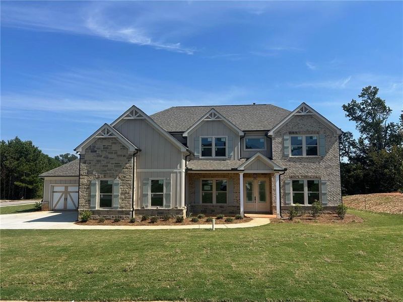 Front exterior of a new home in Sierra Lake, Cumming, GA, highlighting curb appeal (Image 1).