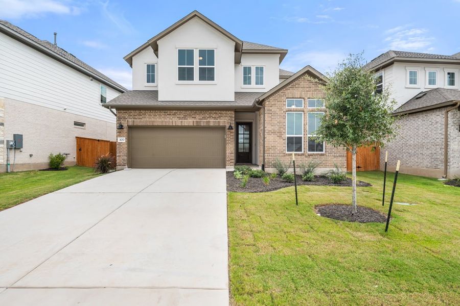 Front exterior of a new home in Arbor Collection at Lariat, Liberty Hill, TX, highlighting curb appeal (Image 1). Front exterior of a new home in Arbor Collection at Lariat, Liberty Hill, TX, highlighting curb appeal (Image 1).