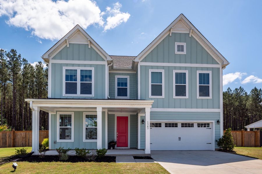 Front exterior of a new home in , Ravenel, SC, highlighting curb appeal (Image 1). Front exterior of a new home in , Ravenel, SC, highlighting curb appeal (Image 1).