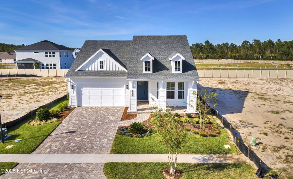 Front exterior of a new home in Seabrook Village II, Ponte Vedra, FL, highlighting curb appeal (Image 29). Front exterior of a new home in Seabrook Village II, Ponte Vedra, FL, highlighting curb appeal (Image 29).