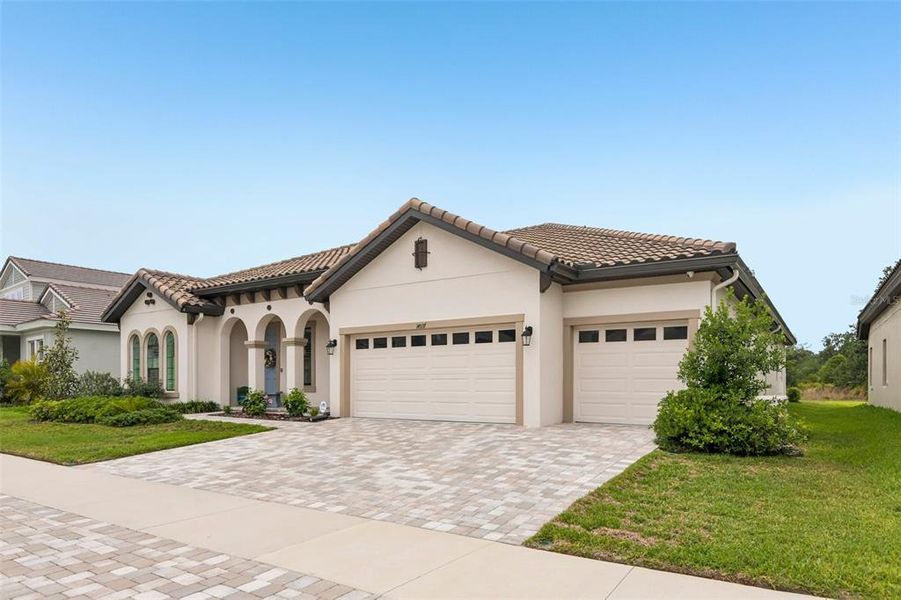 Front exterior of a new home in Hawkstone, Lithia, FL, highlighting curb appeal (Image 21).