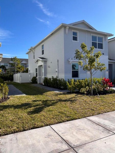 Front exterior of a new home in , Port St. Lucie, FL, highlighting curb appeal (Image 2). Front exterior of a new home in , Port St. Lucie, FL, highlighting curb appeal (Image 2).