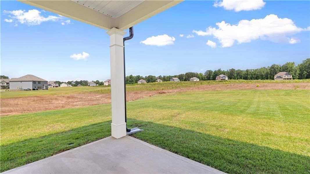 Exterior details and patio area of a home in Teamon Pointe, Griffin (Image 20).