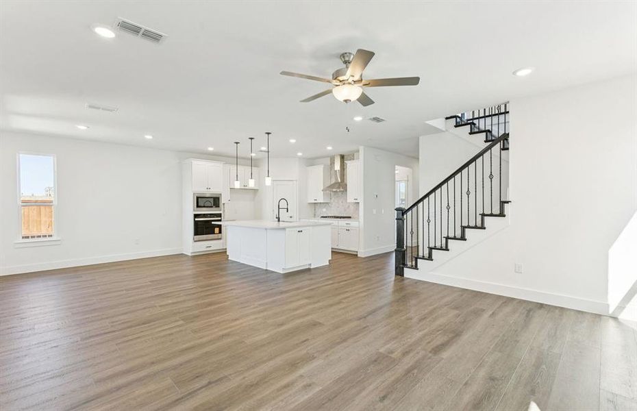 Airy gathering room showcases open concept floorplan