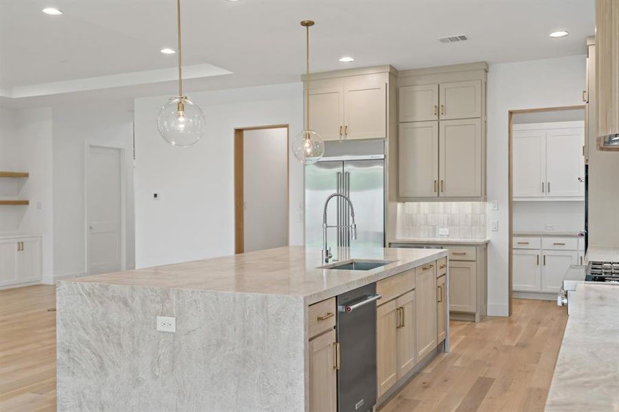 From behind the huge island you overlook the main living area.