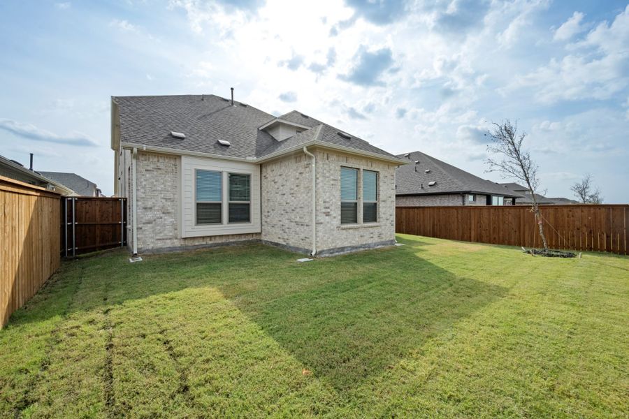 Exterior details and patio area of a home in Creekview Meadows, Pilot Point (Image 17).