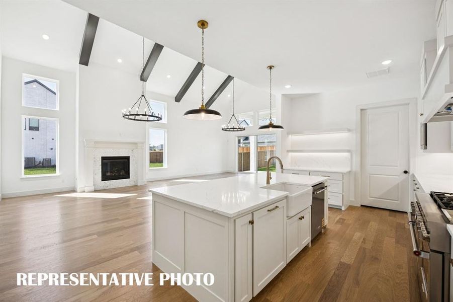 A light, bright and spacious chef's kitchen is only one of the fantastic design elements in this dream home!  REPRESENTATIVE PHOTO