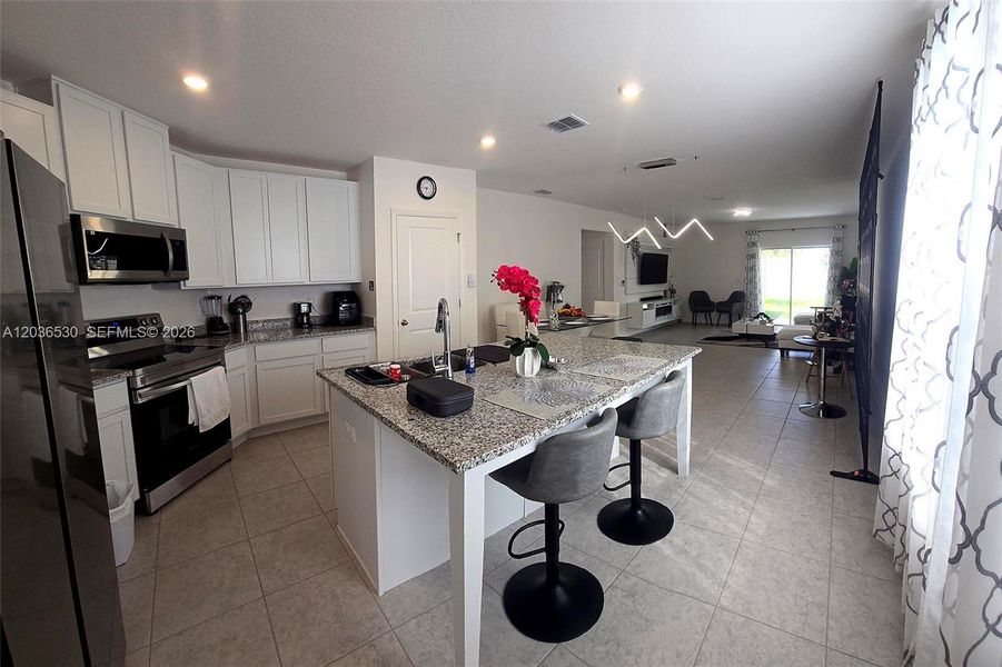Furnished interior view inside a new home in Hammock Reserve, Haines City (Image 11).