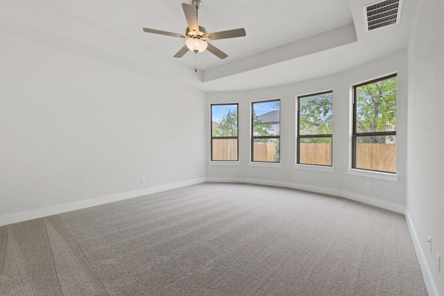 Primary Bedroom with elevated ceiling Primary Bedroom with elevated ceiling