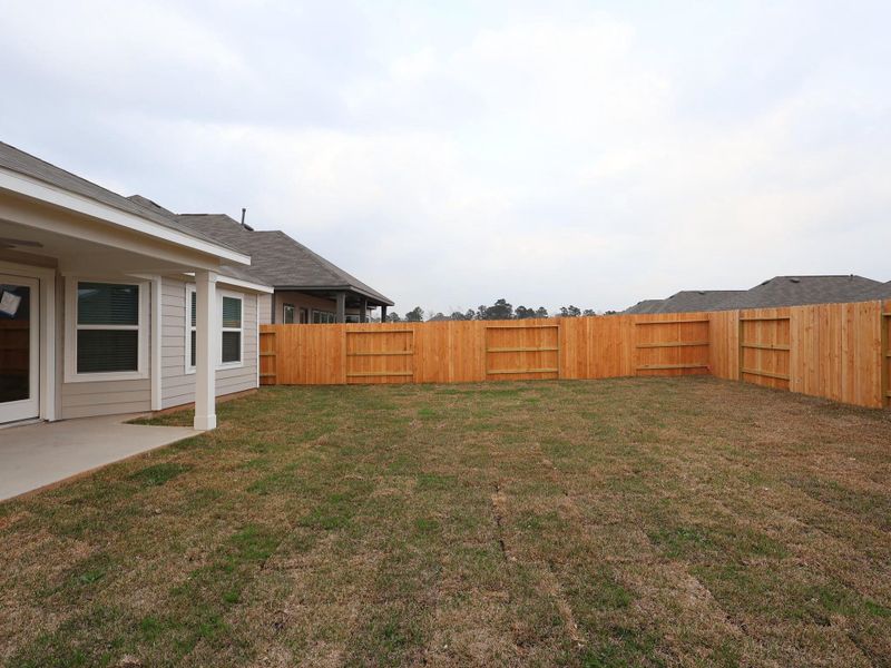 Exterior details and patio area of a home in Lone Star Landing, Montgomery (Image 23). Exterior details and patio area of a home in Lone Star Landing, Montgomery (Image 23).