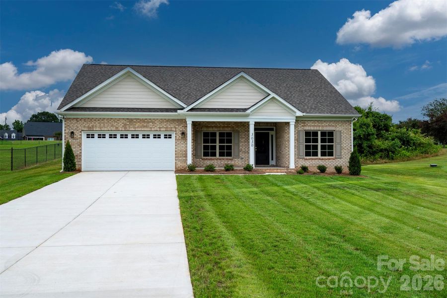 Front exterior of a new home in , Monroe, NC, highlighting curb appeal (Image 1). Front exterior of a new home in , Monroe, NC, highlighting curb appeal (Image 1).