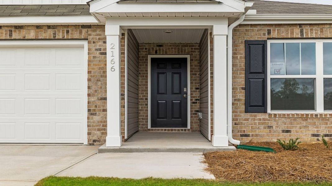 Exterior details and patio area of a home in Ravencrest, Roebuck (Image 3). Exterior details and patio area of a home in Ravencrest, Roebuck (Image 3).