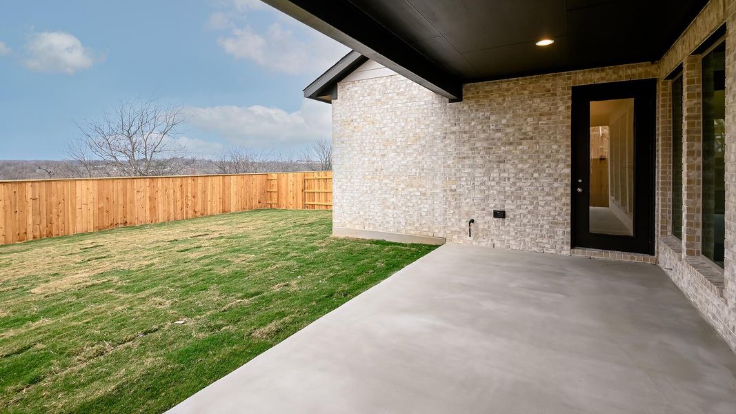 Exterior details and patio area of a home in Crosswinds 50', Kyle (Image 3).