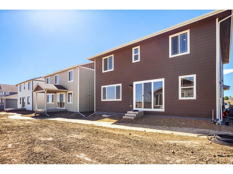 Exterior details and patio area of a home in Farmstead, Berthoud (Image 25).