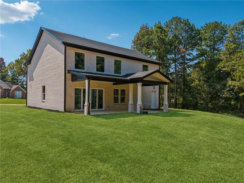 Front exterior of a new home in , Loganville, GA, highlighting curb appeal (Image 20).