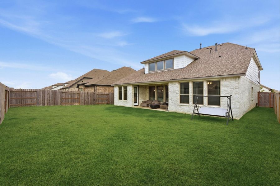 Covered patio and large fenced yard Covered patio and large fenced yard