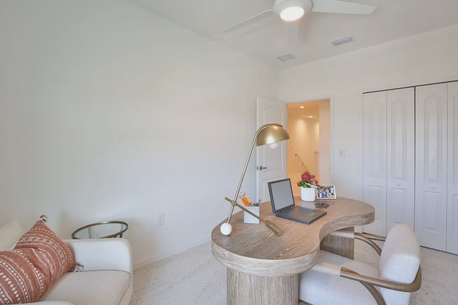 Representative furnished interior of a home built from the Morgan by Neal Communities in SkySail, Naples (Image 8).