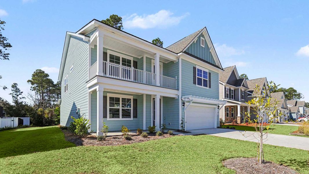 Front exterior of a new home in Heron Pointe, Myrtle Beach, SC, highlighting curb appeal (Image 2). Front exterior of a new home in Heron Pointe, Myrtle Beach, SC, highlighting curb appeal (Image 2).