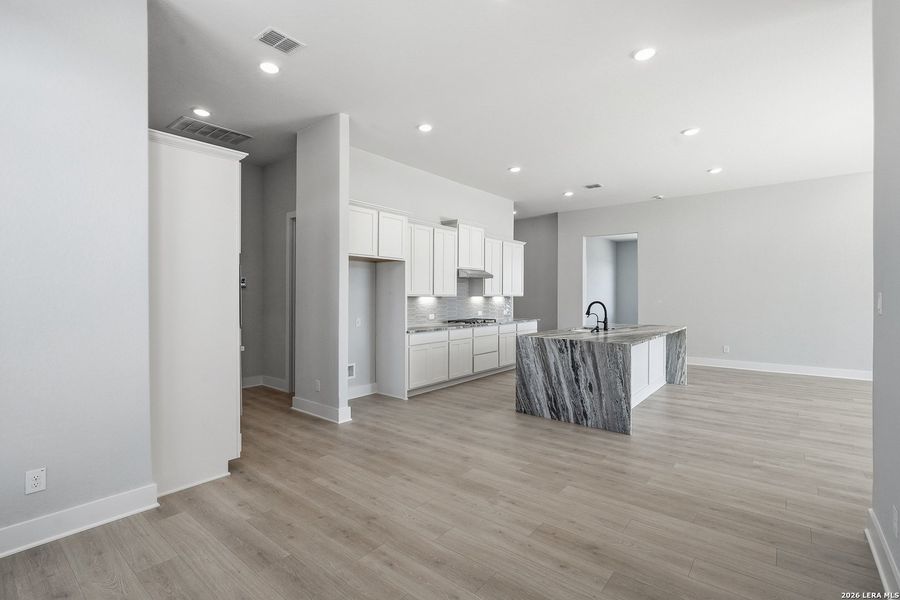 Furnished interior view inside a new home in Potranco Oaks, Castroville (Image 7).